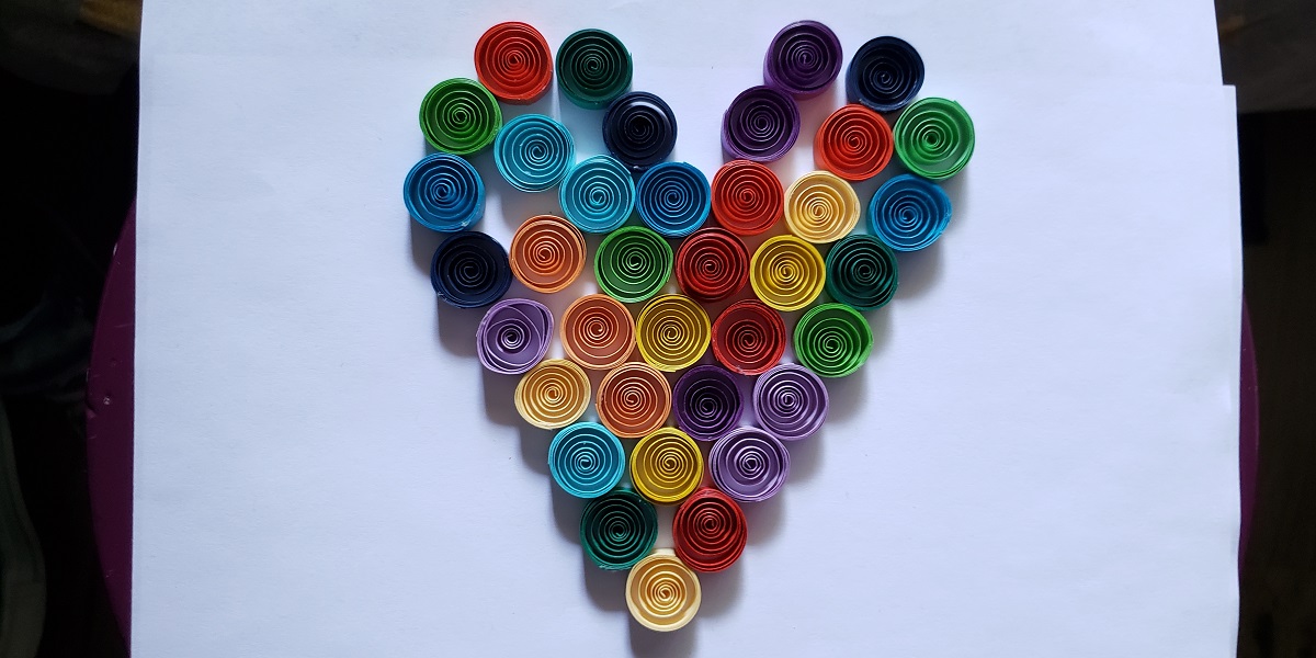 photo of colored paper rolls in heart shape